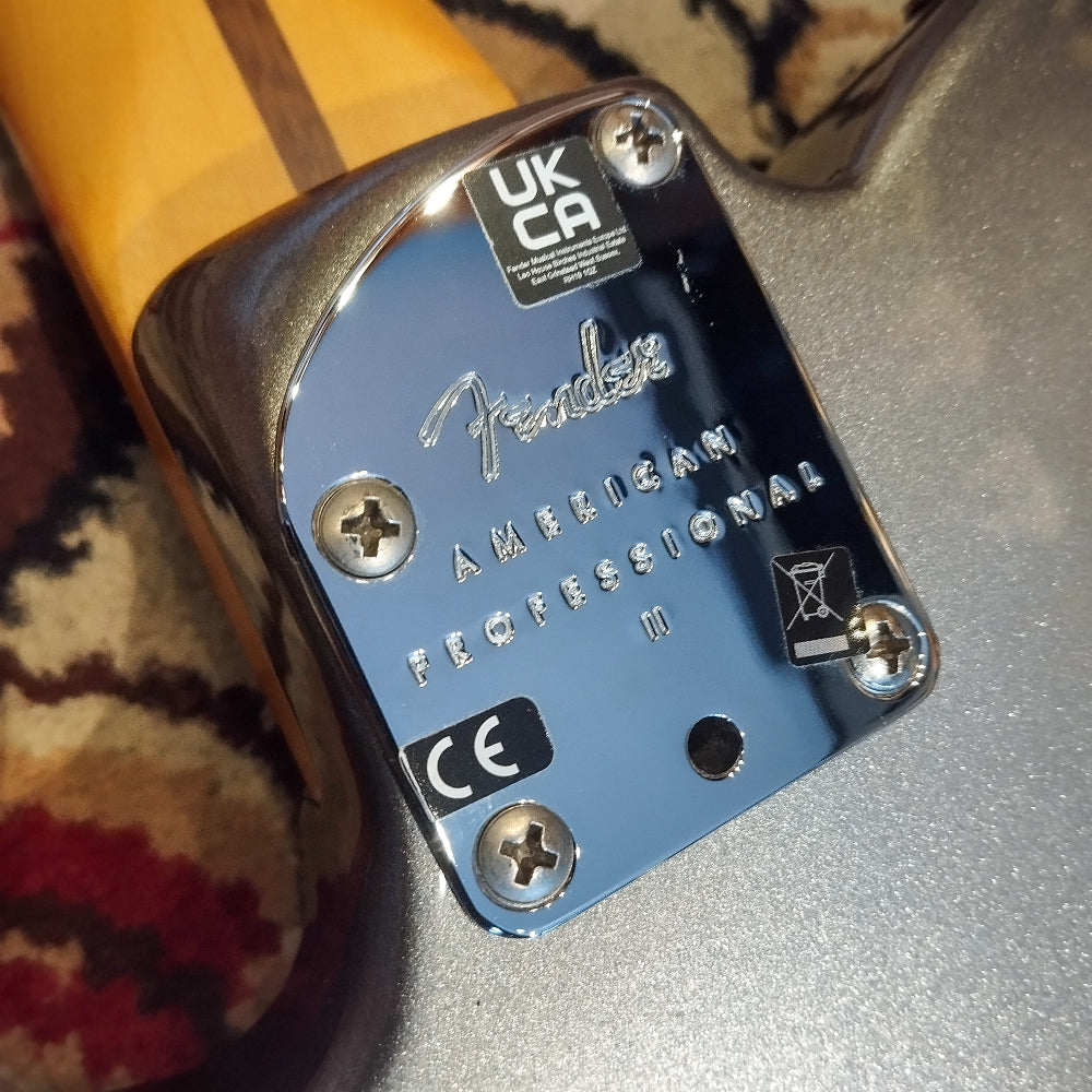 The Fender brand print on the back body of a Fender American Pro II Telecaster Deluxe, located near the neck joint.