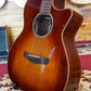 Front body of an acoustic guitar placed on a guitar stand