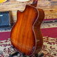 Back body of an acoustic guitar placed on a guitar stand