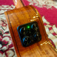  Close-up of the ukulele’s preamp system on the side