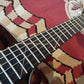 Fretboard of an acoustic guitar with natural wood color