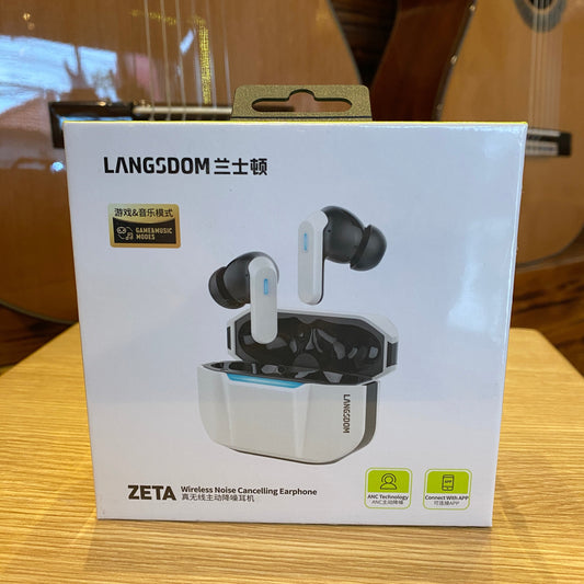 Box of LANGDOOM ZETA earbuds on a wooden surface with a guitar in the background