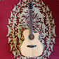 Acoustic guitar with a solid spruce top, acacia back and sides, and rosewood fingerboard. The guitar is displayed on a patterned red and beige rug without a case.