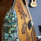 The armrest of the Blueberry Dragon guitar featuring detailed dragon artwork matching the guitar's body design.