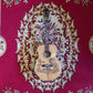 A wooden guitar featuring a detailed painting of a Blueberry Dragon on the body